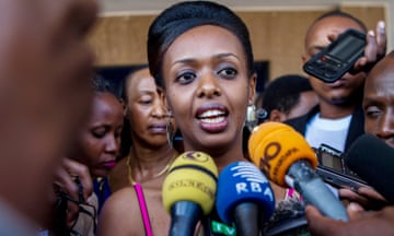 Diane Shima Rwigara surrounded by microphones as she speaks to the media