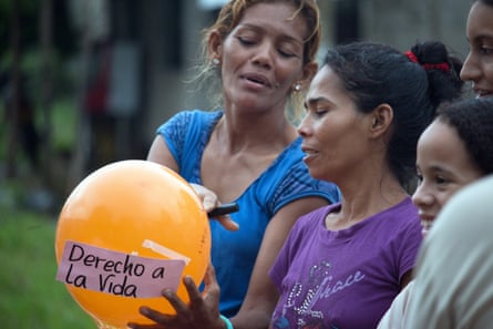Residents of the Villa Fanny neighbourhood in Fundación, Colombia, take part in a workshop on women’s rights. The sign on the balloon reads: ‘right to life’. 
