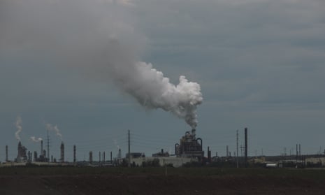An image of of steam being released from a facility.