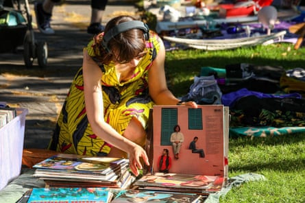 Young woman Browsing vinyl at pop-up flea market in the Kallio district of Helsinki,