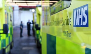 Ambulances stand outside an NHS hospital in London.