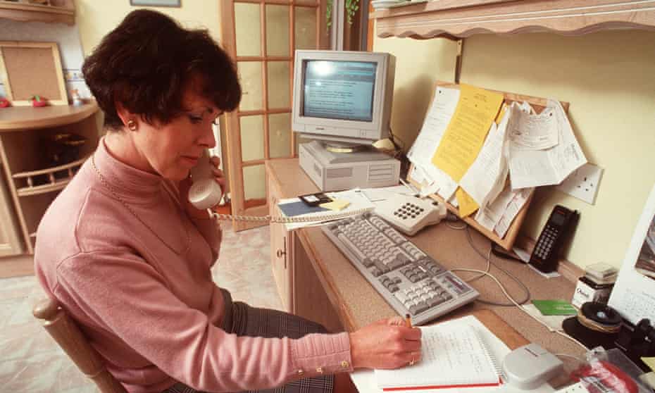 A woman working from home with desk-top computer in 1999.