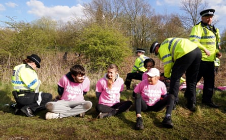 Members of the Animal Rising protest group being arrested at Aintree in 2023