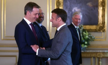 Belgian prime minister, Alexander de Croo (left) welcomes France’s Emmanuel Macron (centre) as Belgium’s King Philippe (right), Belgian Prime Minister Alexander De Croo (L) look on, ahead of a special meeting of the European Council in Brussels.