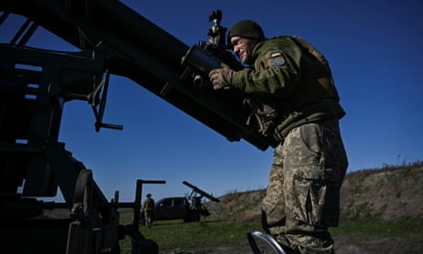 A Ukrainian serviceman prepares a Partyzan small multiple rocket launch system for firing toward Russian troops near a frontline, in Zaporizhzhia region, Ukraine.