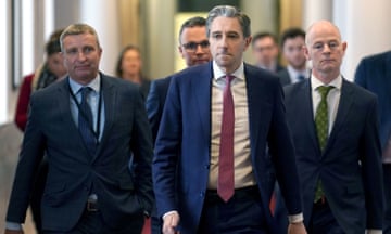 Simon Harris flanked by ministers in Government Buildings in Dublin