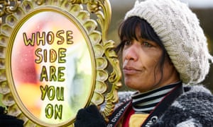 Nana Cheryl Atkinson holding up a mirror to police that says 'Whose side are you on' as Frack Free Lancashire protesters demonstrate at a site at Preston New Road