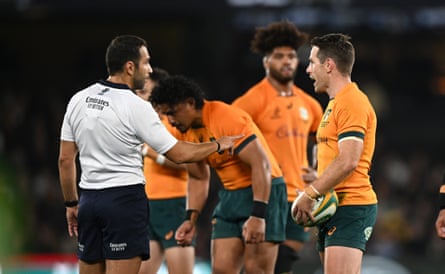 The referee, Mathieu Raynal, explains his dramatic decision to penalise Australia for time-wasting to Bernard Foley.