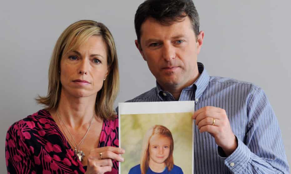 Kate and Gerry McCann in 2013, holding an age-progressed police image of their missing daughter.