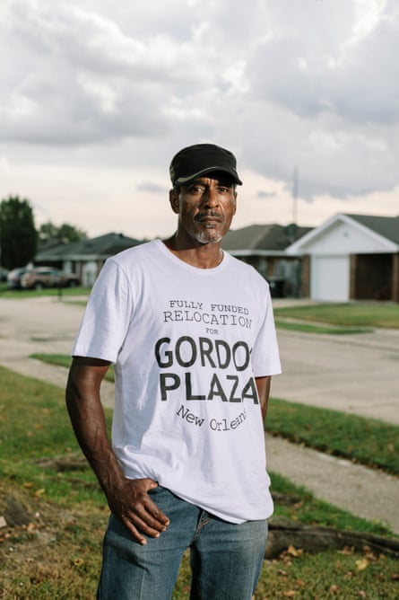 Jesse Perkins stands in the front yard of the Gordon Plaza home he moved into in 1988. Over the years, Perkins has shared the home with his mother, and now his son and granddaughter. After getting the property’s soil tested for lead, Perkins decided that it was safer to keep his granddaughter from playing outside altogether.