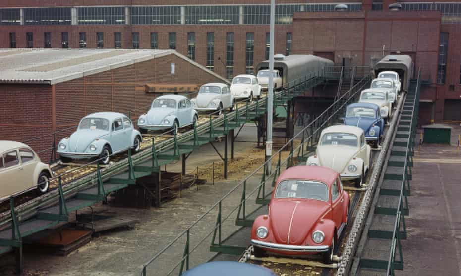 New VW Beetles emerging on a conveyor belt from the production line of a factory in Wolfsburg in West Germany in 1970.
