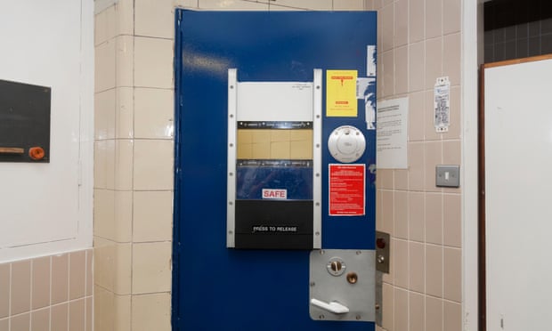 A cell door in a police station custody suite