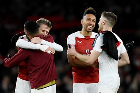 Aubameyang celebrates with team mates after Arsenal win 3-0.
