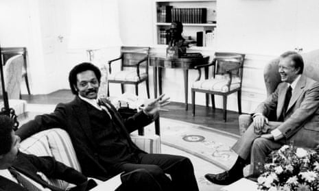 Reverend Jessie Jackson attends an Oval Office meeting with Jimmy Carter in 1979.