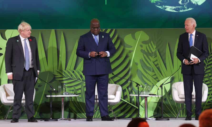 British Prime Minister Boris Johnson, President of Congo Felix Tshisekedi and US President Joe Biden onstage during an Action on Forests and Land Use event.