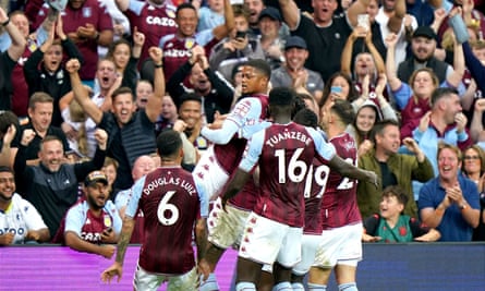 Aston Villa players and fans celebrate after Everton’s Lucas Digne scored an own goal to make it 2-0