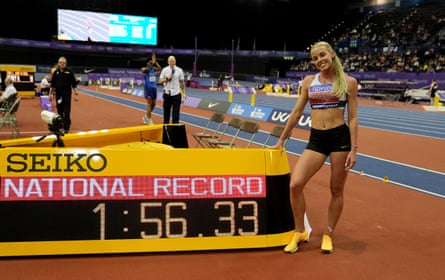 Keely Hodgkinson stands next to her 800m national record time
