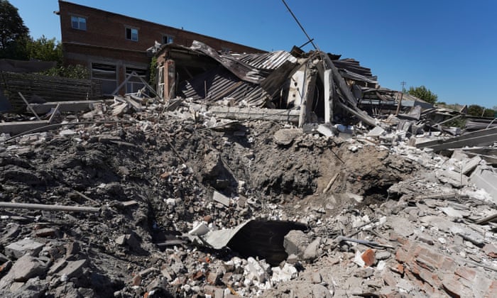A shelling hole near a damaged factory after a rocket hit in Kharkiv, Ukraine. Kharkiv and surrounding areas have been the target of heavy shelling since February.