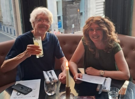 Andew & Gilli sitting together and looking relaxed in a restaurant