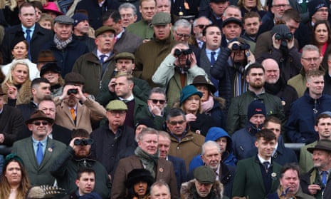 Racegoers watch the Ballymore Novice Hurdle. REUTERS/Paul Childs
