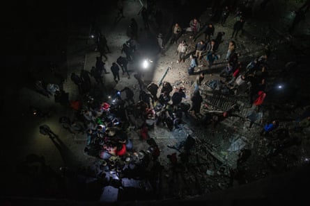An aerial image of people taken in the dark after an Israeli strike