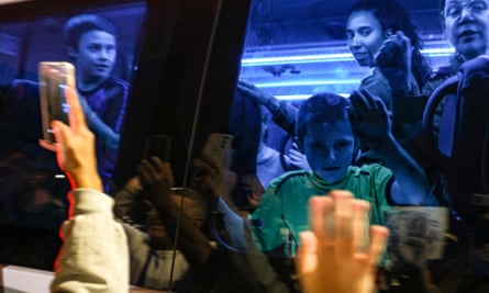 Gal and Tal on a bus transporting them to an army base in southern Israel after they were released by Hamas