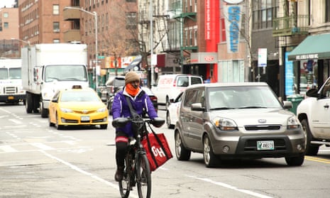 A cyclist travels through New York city amidst the global outbreak