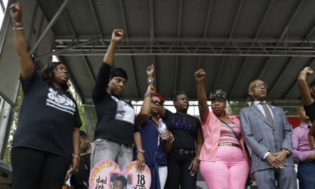 The Rev Al Sharpton, right, is joined on stage by mothers of those killed by police or vigilantes: Oscar Grant’s mother, Wanda Johnson, left; Ramarley Graham’s mother, Constance Malcolm, second from left; Michael Brown’s mother, Leslie McSpadden, third from left; Trayvon Martin’s mother, Sybrina Fulton, third from right; and Eric Garner’s mother, Gwen Carr, during a rally in New York in 2015.