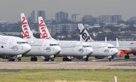 Virgin Australia and Jetstar Boeing 737-800 aircraft parked on one of the three runways at Sydney's Kingsford Smith Airport