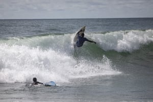 A surfer performs a turn in Robertsport