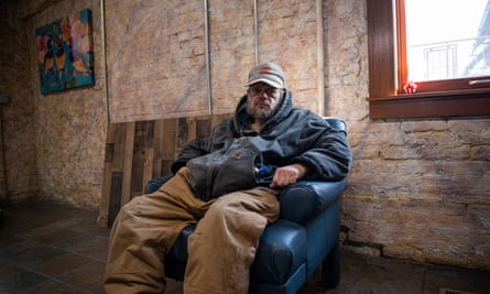 Carver, wearing a hat and oversize parka with tattoos around his eyes, stared into the camera.