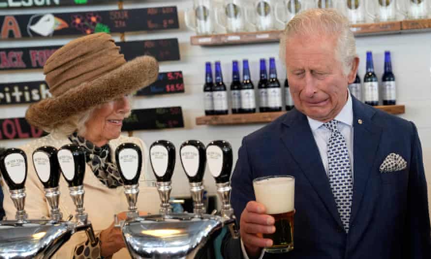 Prince Charles reacts to a bad pour of beer he made at a brewery in St John's, Newfoundland and Labrador, Canada