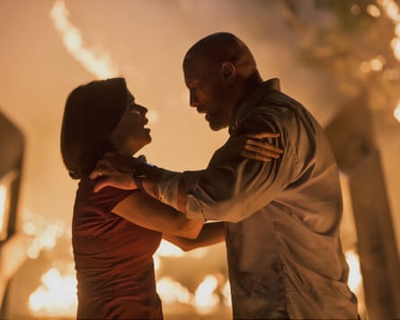 Neve Campbell and Dwayne Johnson star in Skyscraper.