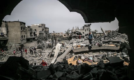 scene of destruction with people searching