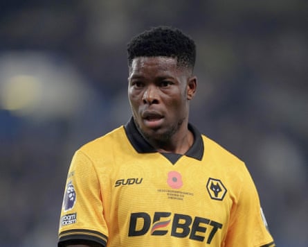Head and shoulders photograph of Marshall Munetsi in a yellow kit top