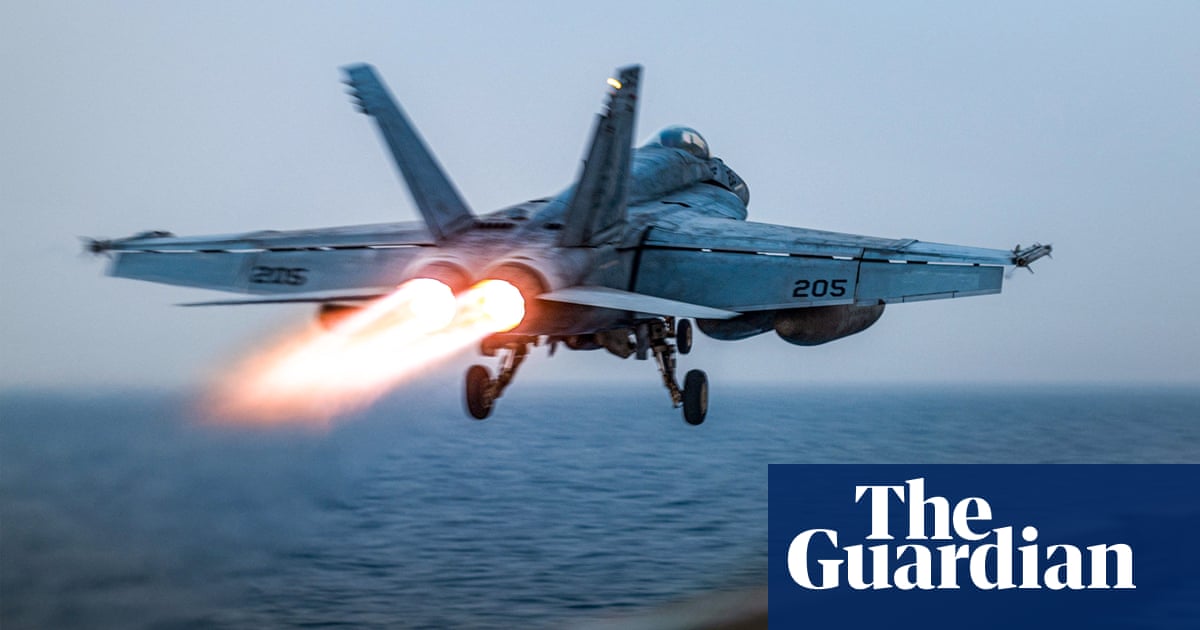 US fighter jet rolls off aircraft carrier as ship reportedly swerves Houthi fire