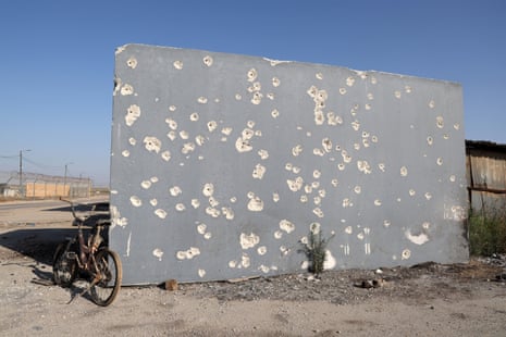 A bicycle rests near the wall of a shelter riddled with bullets during the 7 October Hamas attacks, at kibbutz Nahal Oz in southern Israel on Thursday.
