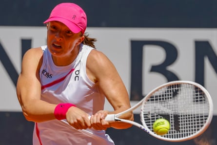 Iga Swiatek plays a shot against Yulia Putintseva
