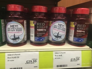 Greenpeace stickers on bottles of Holland & Barrett red krill oil
