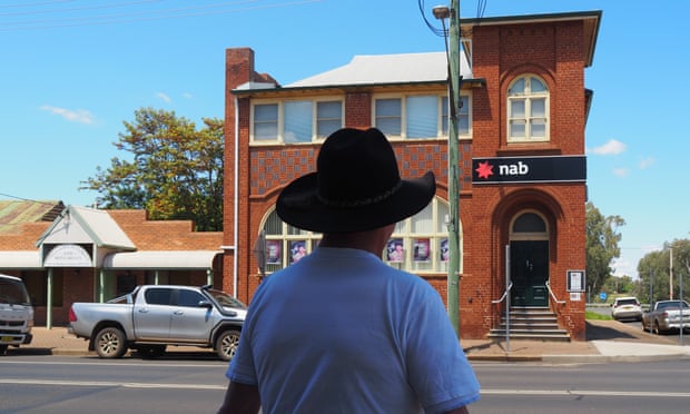 Retired farmer Wayne Ross outside the National Australia Bank branch in Gilgandra, NSW