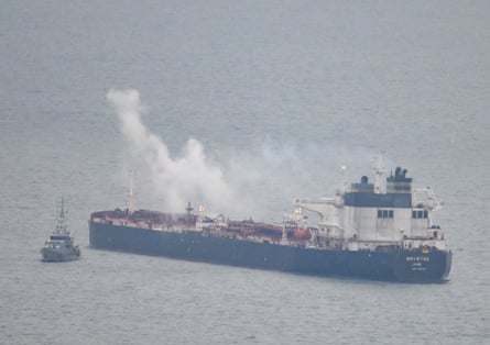 A border security vessel patrols the detained Smyrtos vessel outside Portland harbour