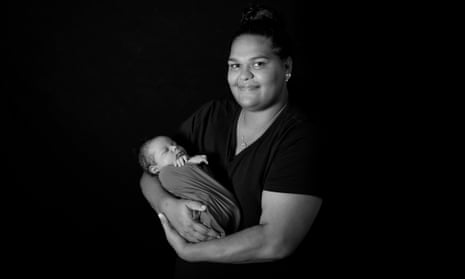 Midwife Cherisse Buzzacott holds her baby. Facing expectation and pressure to have children, she struggled in the way that many do alone