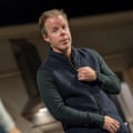 An actor adjusts his jumper's zip during a Some Woman rehearsal at the National Theatre