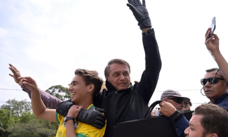 Nikolas Ferreira, left, a far-right personality whose profile has been suspended by Twitter, campaigns with President Jair Bolsonaro in September.