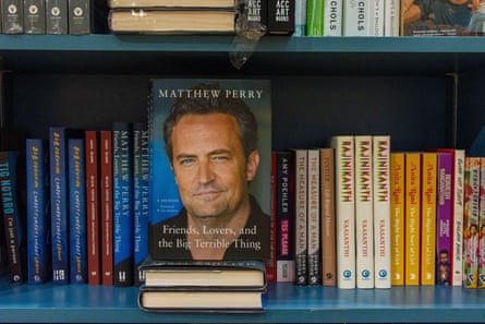 Matthew Perry’s Friends, Lovers, and the Big Terrible Thing book on a bookshelf in the bookstore