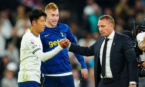 Brendan Rodgers cuts a dejected figure as he shakes the hand of Son Heung-min.