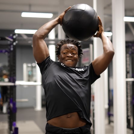Benson Jerry, a defensive lineman from Nigeria, throws a medicine ball during a weights session for the NFL Academy in the Powerbase Gym at Loughborough University.