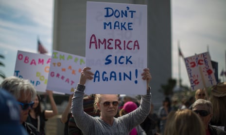 People protest Trump administration policies that threaten the Affordable Care Act, Medicare and Medicaid on 25 January 2017 in Los Angeles, California.