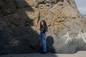 Rose Strauss, a member of the Sunrise movement, poses for a portrait at Campus Point in Santa Barbara on Thursday