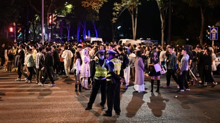 Police at a Halloween parade in Shanghai.